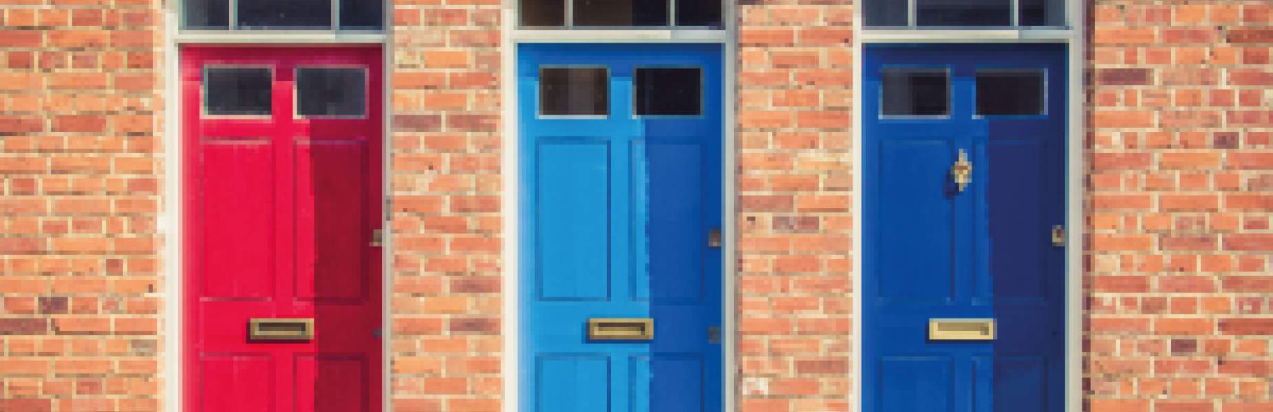 Three house doors in red, light blue and dark blue colours