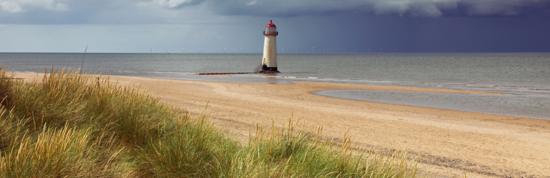 a beach and lighthouse