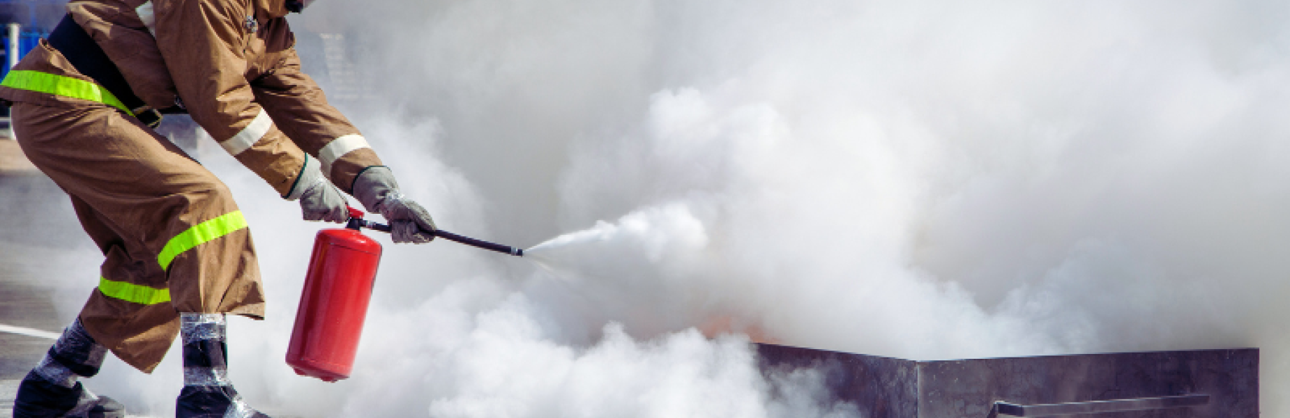 fire being extinguished by a firefighter