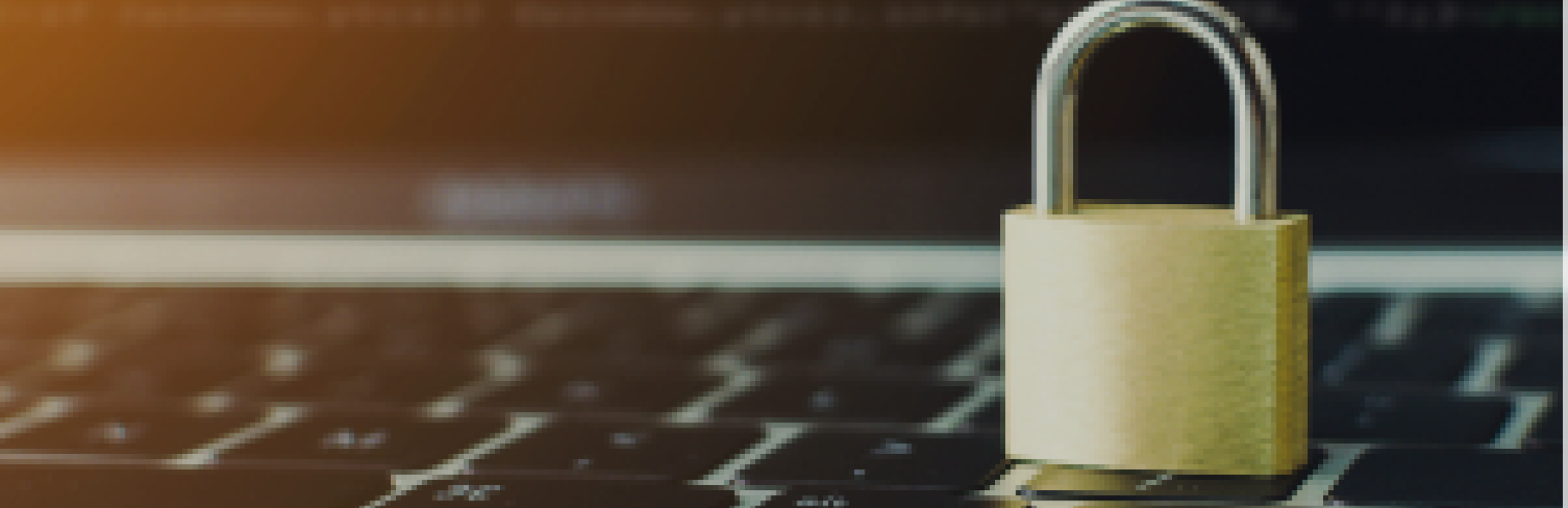 Padlock resting on a laptop keyboard