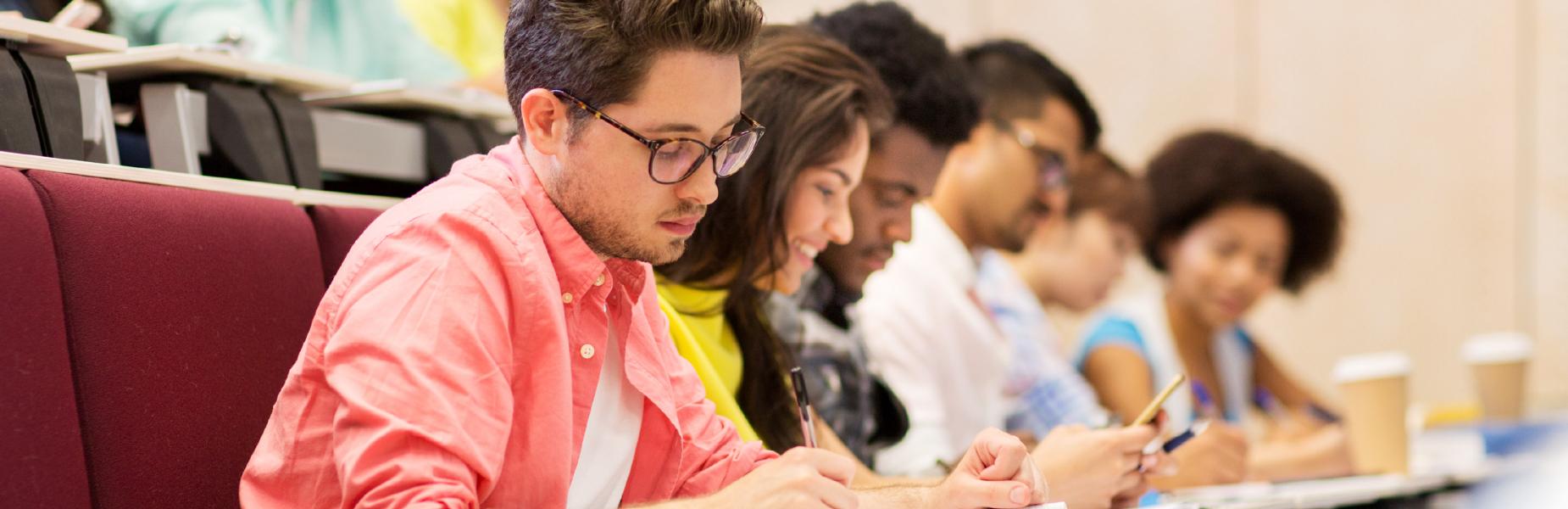 a group of students working at a desk