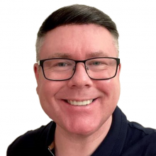 Headshot photograph of Darren Griffiths
